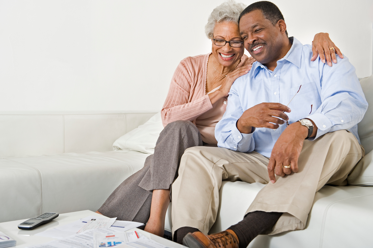 Couple With Investment Paperwork