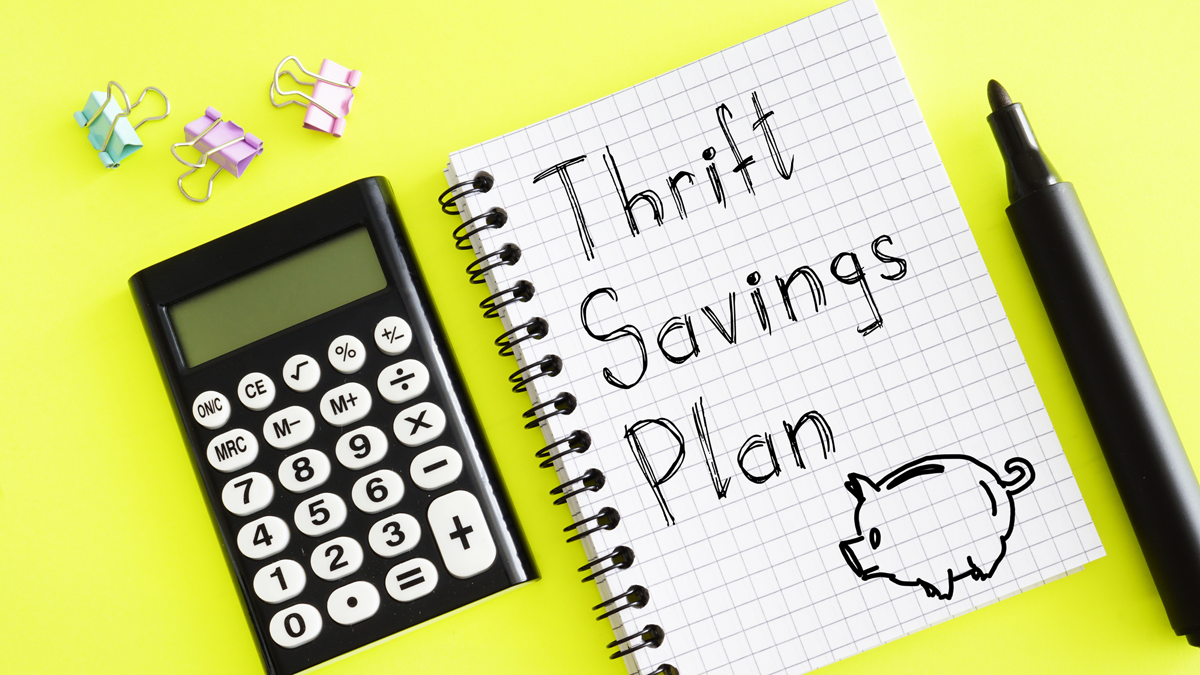Thrift Savings Plan Illustration With Calculator And Notebook